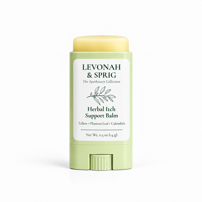 LEVONAH & SPRIG Herbal Itch Support Balm in an open, light sage-green twist-up tube, revealing the pale yellow balm above the container. The label features botanical artwork and highlights tallow, plantain leaf, and calendula.