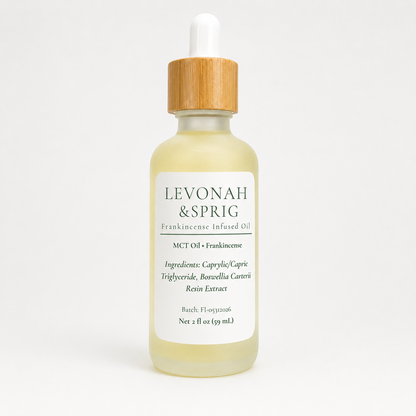 Levonah & Sprig Frankincense Infused Oil in a 2 fl oz frosted glass dropper bottle with a bamboo cap, featuring an MCT oil and frankincense formula, photographed on a clean white background.